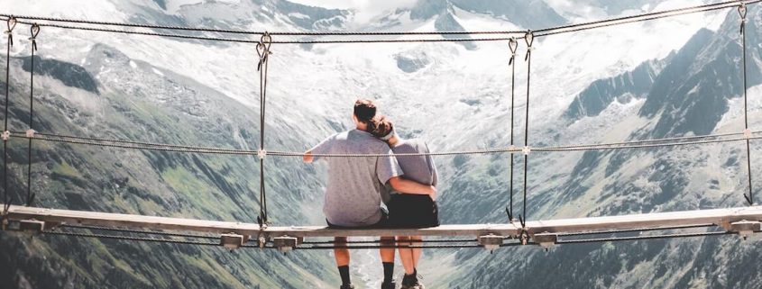 couple on mountain bridge